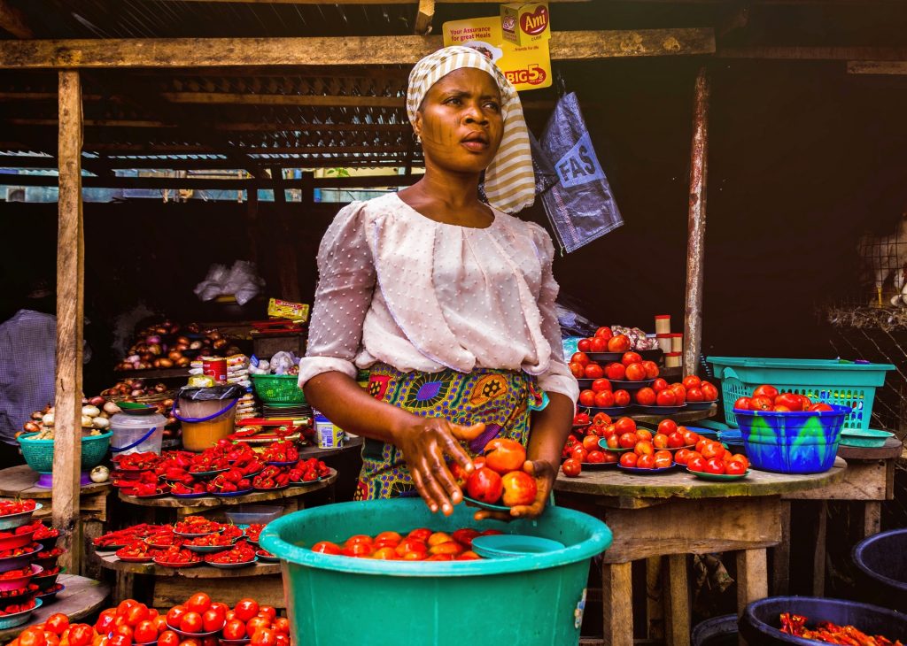 woman standing in fruit market