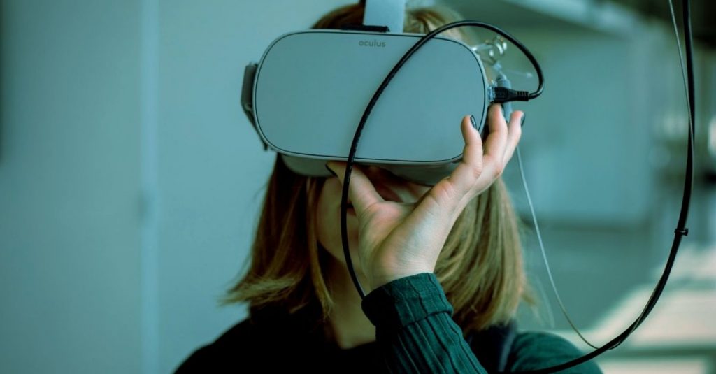 person wearing Oculus VR mask